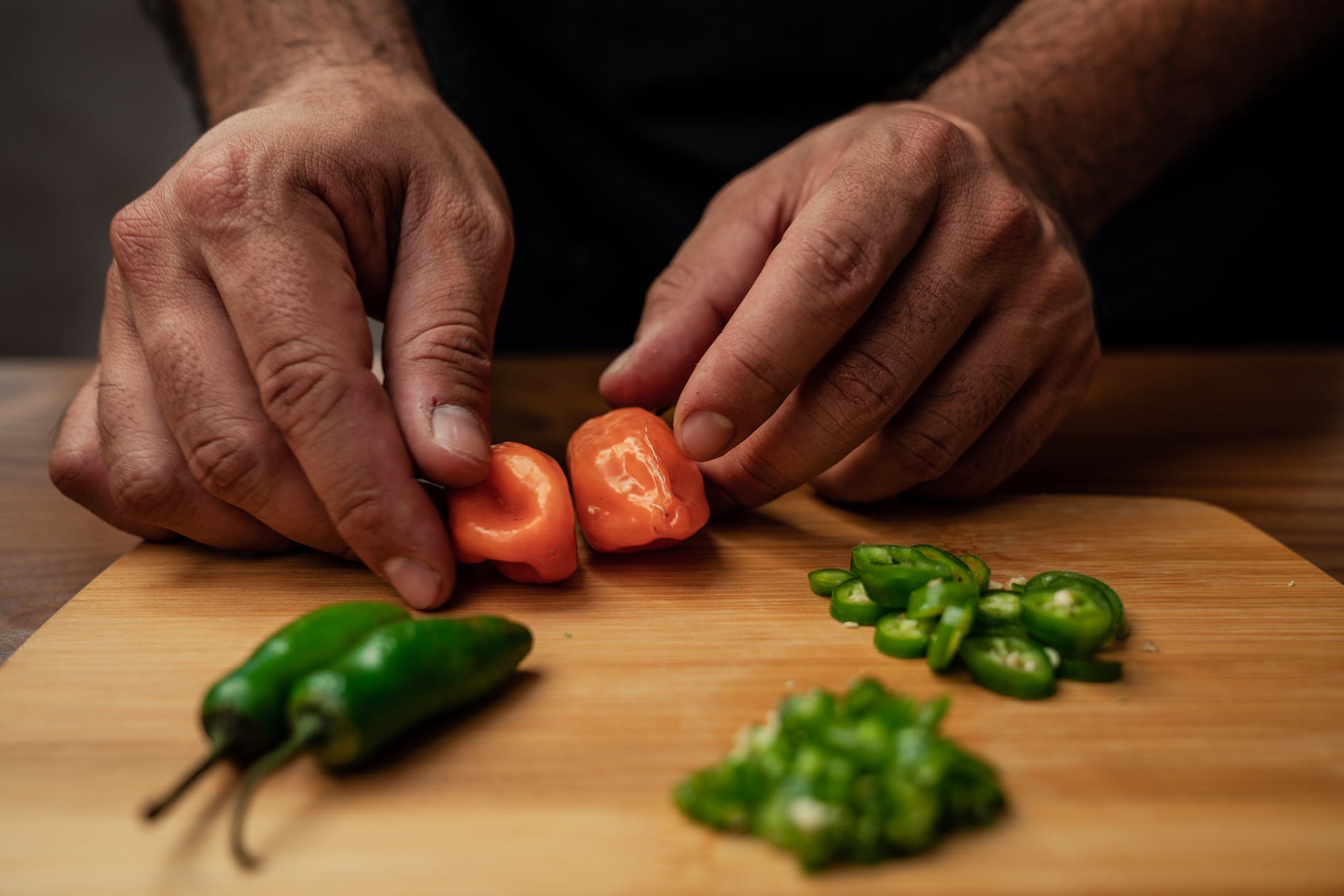 person holding ghost peppers